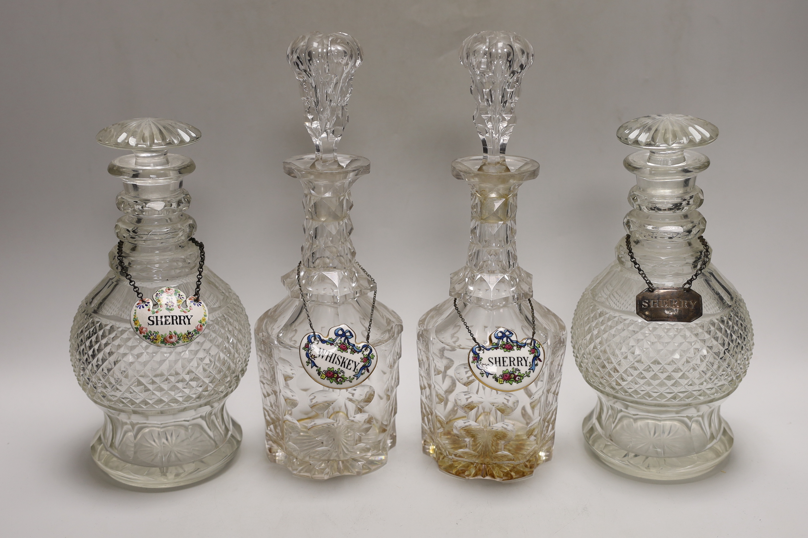 Two pairs of Victorian decanters, a silver wine label and three others